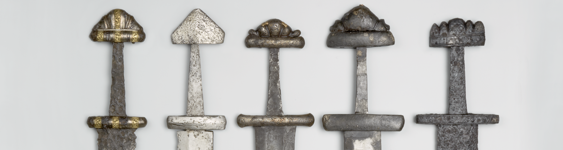 Row of viking age swords.