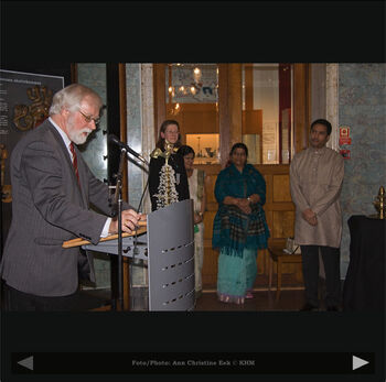 Microphone ,Public address system ,Coat ,Standing ,Musician.