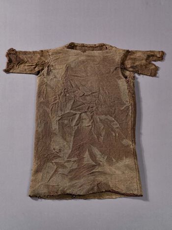 Oldest surviving garment in Norway. The tunic was preserved in the ice in Jotunheimen for 1700 years and reappeared in 2011. Wool tunic from Lendbreen in Lom, Innlandet, 230-390 CE. C57874. View large format .