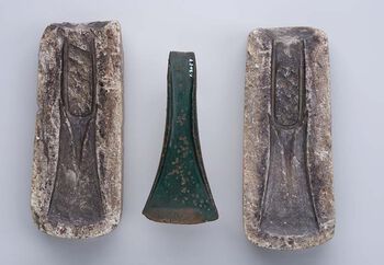 Bronze axe from Morstad in Gran, Innlandet. 1700-1500 BCE. Casting mold in soapstone. Prestevatn, Farsund, Agder. 1500-1300 BCE. C21853. View large format .